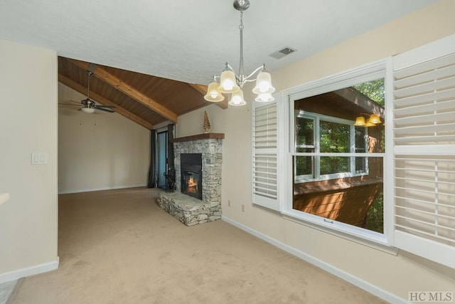 unfurnished living room with wood ceiling, a fireplace, lofted ceiling with beams, and carpet