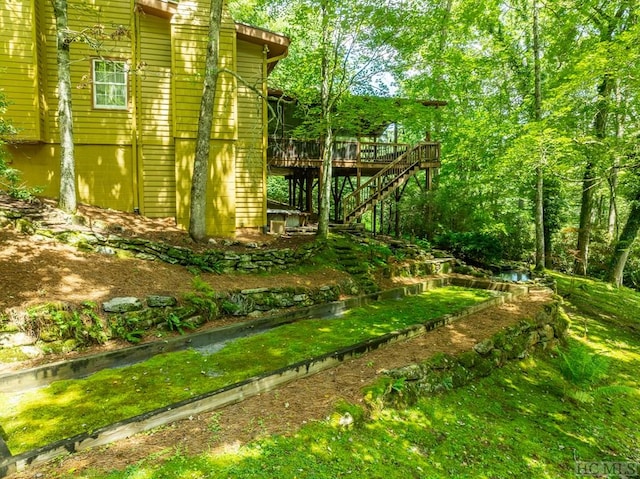 view of yard with a wooden deck