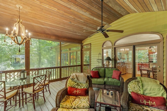 sunroom with lofted ceiling, wooden ceiling, and ceiling fan with notable chandelier