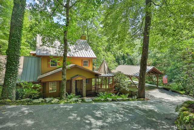 view of front of home featuring a carport