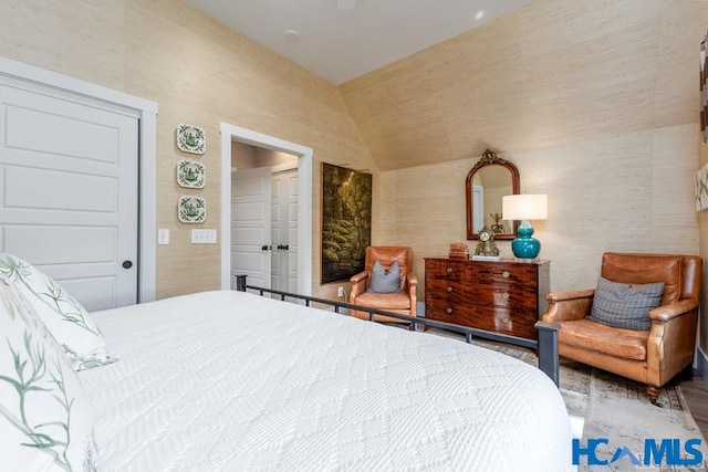 bedroom with a ceiling fan and vaulted ceiling