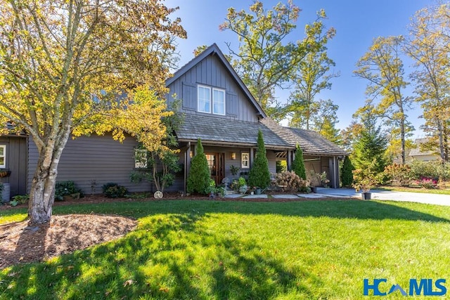 view of front of house featuring board and batten siding and a front lawn