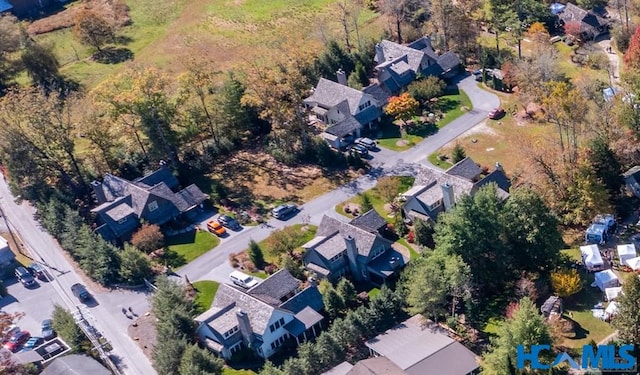 birds eye view of property with a residential view