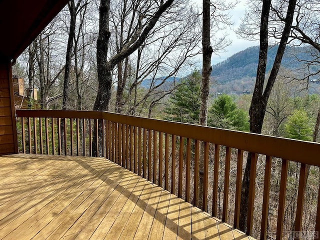 wooden deck featuring a mountain view