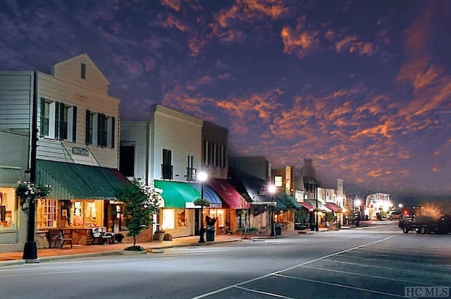 view of outdoor building at dusk