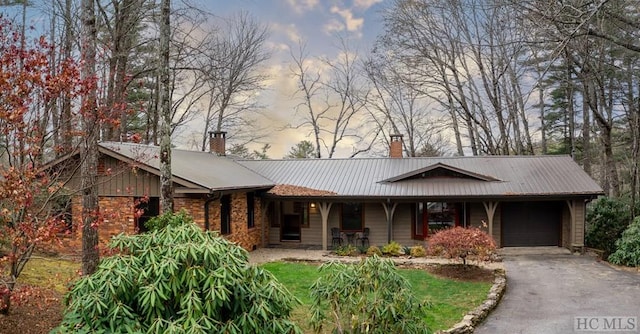 ranch-style house featuring a garage