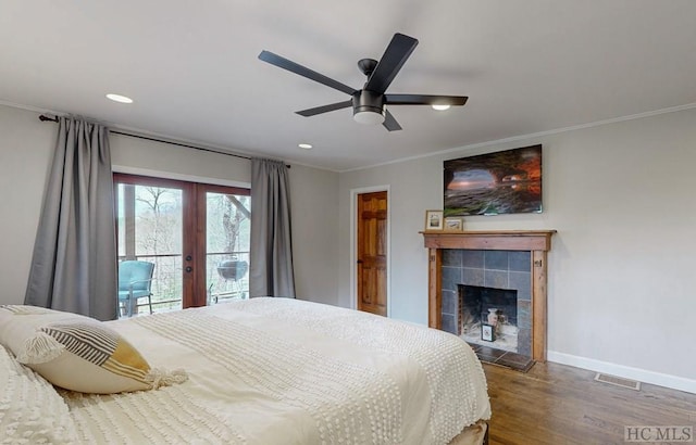 bedroom featuring french doors, crown molding, wood-type flooring, ceiling fan, and access to exterior