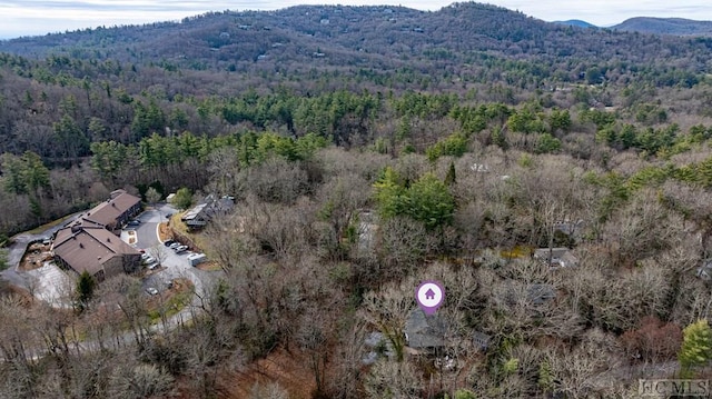 48 Holt Knob Rd, Highlands, NC 28741 - aerial view of property and surrounding area featuring a heavily wooded area and a mountainous background