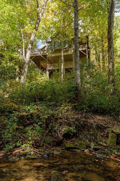 61 Indian Falls Way, Lake Toxaway, NC 28747 - back of property with a view of trees and a balcony