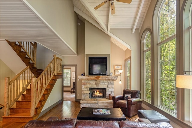 61 Indian Falls Way, Lake Toxaway, NC 28747 - living area with wood finished floors, beamed ceiling, ceiling fan, stairway, and a fireplace