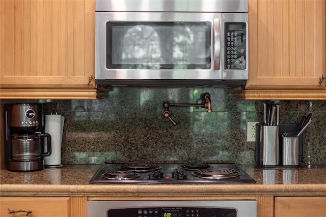 61 Indian Falls Way, Lake Toxaway, NC 28747 - kitchen featuring stainless steel appliances, tile countertops, and tasteful backsplash
