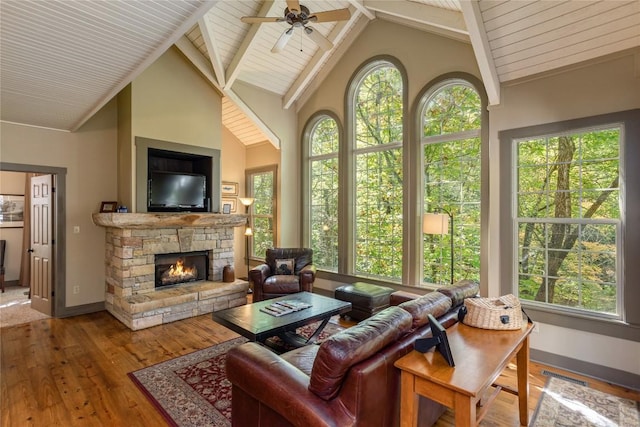 61 Indian Falls Way, Lake Toxaway, NC 28747 - living room with hardwood / wood-style flooring, a ceiling fan, a fireplace, high vaulted ceiling, and a wooden ceiling with exposed beams