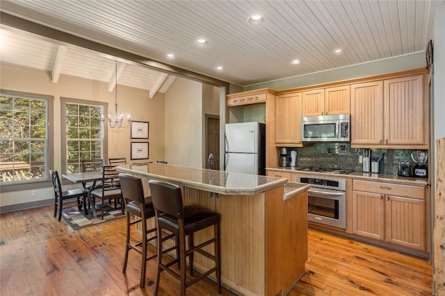 61 Indian Falls Way, Lake Toxaway, NC 28747 - kitchen with stainless steel appliances, wood ceiling, a kitchen island, decorative backsplash, and a chandelier