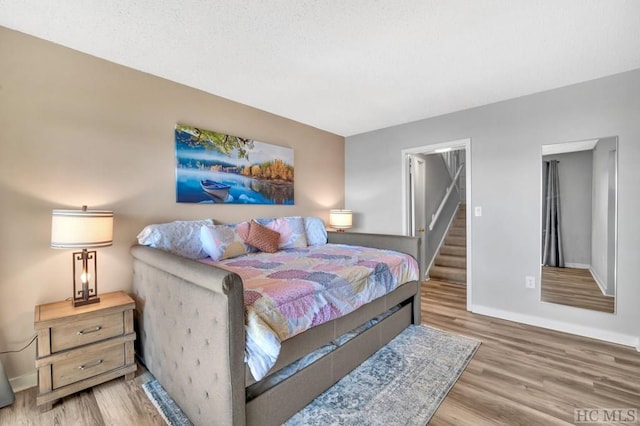 bedroom featuring wood-type flooring