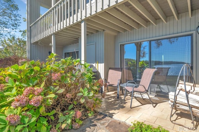 view of patio featuring a balcony