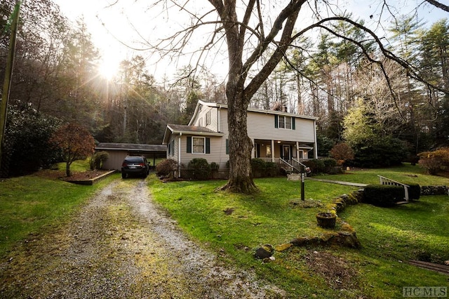 view of front of house with a porch and a front yard