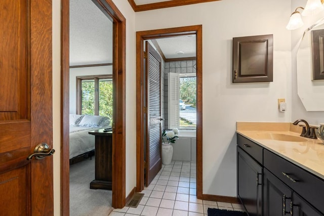 776 Stillmont Cir, Cashiers, NC 28717 - ensuite bathroom featuring ornamental molding, baseboards, tile patterned flooring, and a healthy amount of sunlight