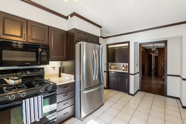 776 Stillmont Cir, Cashiers, NC 28717 - kitchen featuring light tile patterned floors, light countertops, crown molding, dark brown cabinets, and black appliances