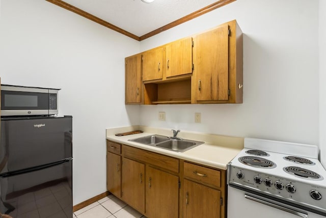 776 Stillmont Cir, Cashiers, NC 28717 - kitchen with white electric range oven, freestanding refrigerator, ornamental molding, stainless steel microwave, and a sink