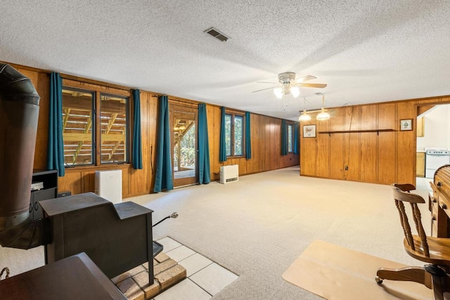 776 Stillmont Cir, Cashiers, NC 28717 - interior space featuring wooden walls, visible vents, ceiling fan, and carpet floors