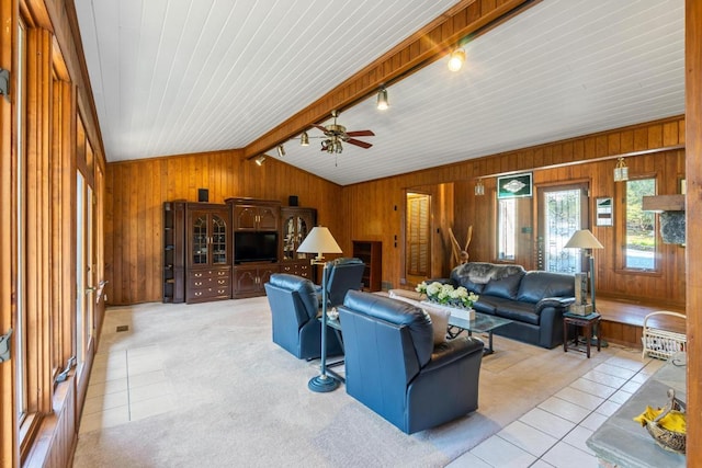 776 Stillmont Cir, Cashiers, NC 28717 - living area with wood walls, vaulted ceiling with beams, light tile patterned floors, and a ceiling fan