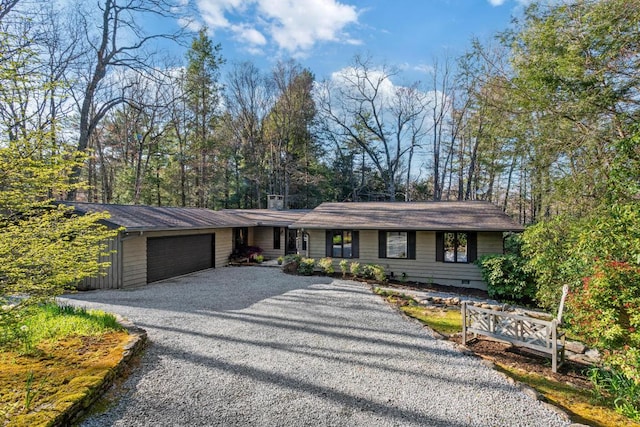 776 Stillmont Cir, Cashiers, NC 28717 - view of front of house featuring an attached garage, a chimney, and gravel driveway