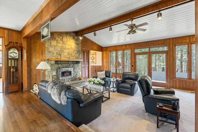 776 Stillmont Cir, Cashiers, NC 28717 - living area with a ceiling fan, wood finished floors, wood walls, and vaulted ceiling with beams