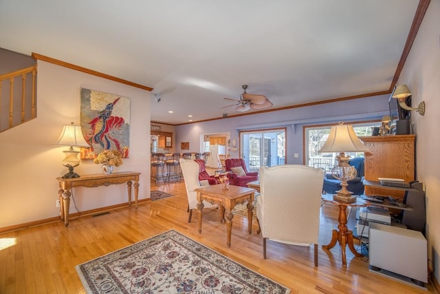 11 Lower Tanglewood Dr E, Lake Toxaway, NC 28747 - living room featuring visible vents, baseboards, ornamental molding, ceiling fan, and wood finished floors