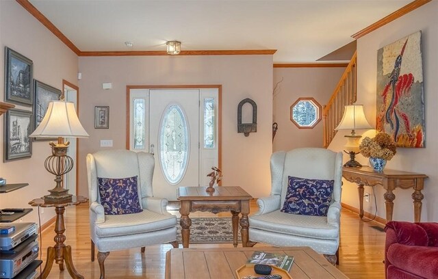 11 Lower Tanglewood Dr E, Lake Toxaway, NC 28747 - living area featuring wood finished floors, baseboards, ornamental molding, and stairs