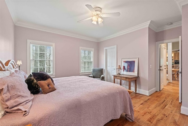 bedroom featuring light wood-style flooring, a ceiling fan, baseboards, and ornamental molding