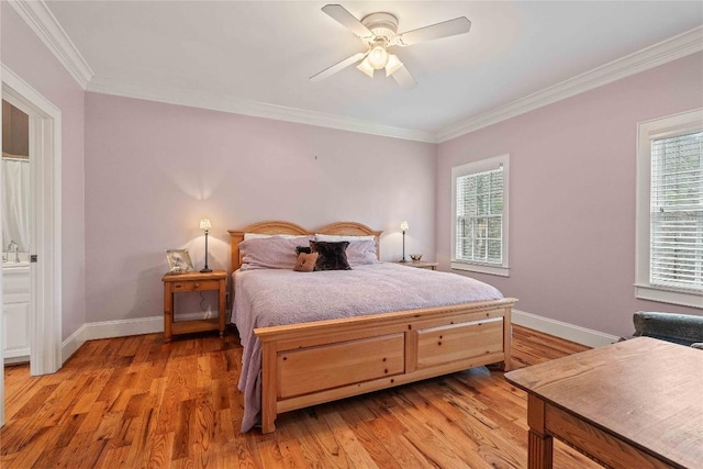 bedroom with light wood-style flooring, baseboards, and ornamental molding