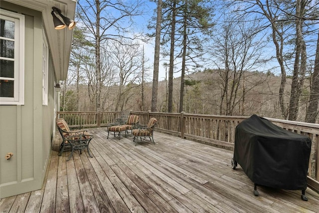 wooden deck with grilling area