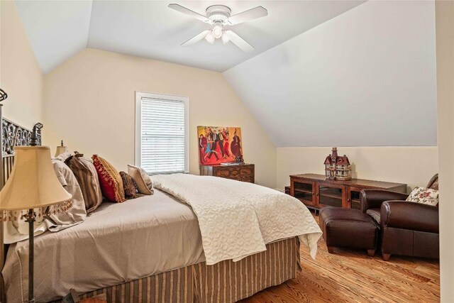 bathroom featuring connected bathroom, ceiling fan, ornamental molding, wood finished floors, and vanity