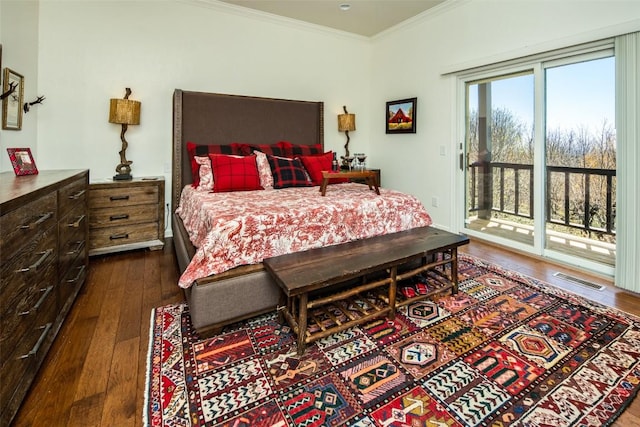 bedroom with access to exterior, dark wood-style flooring, and ornamental molding