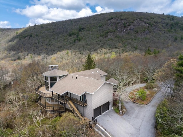 view of subject property featuring a mountainous background