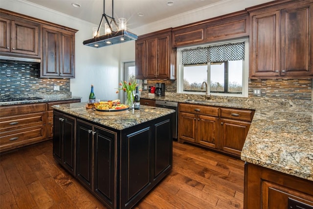 kitchen featuring a sink, dishwashing machine, backsplash, ornamental molding, and dark wood-style flooring