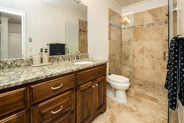 full bathroom featuring crown molding, a stall shower, toilet, and vanity