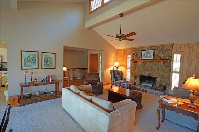855 Sky Lake Dr, Highlands, NC 28741 - living area featuring a high ceiling, a stone fireplace, ceiling fan, wood walls, and carpet floors