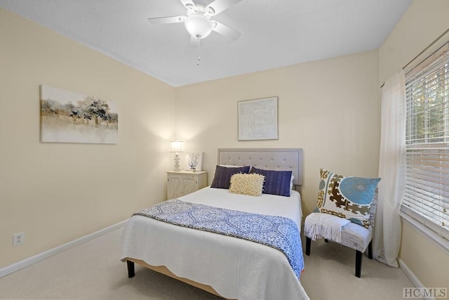 bedroom with ceiling fan and carpet floors