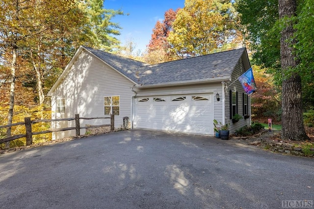 view of side of property featuring a garage