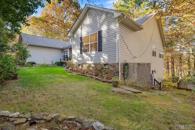 rear view of house featuring a lawn