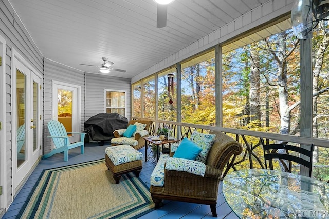 sunroom / solarium with ceiling fan