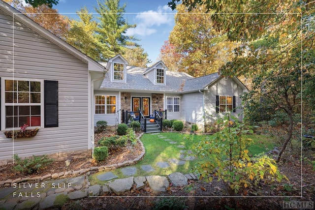 cape cod-style house with a front lawn