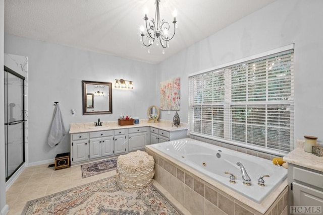 bathroom featuring tile patterned floors, separate shower and tub, a textured ceiling, vanity, and a notable chandelier