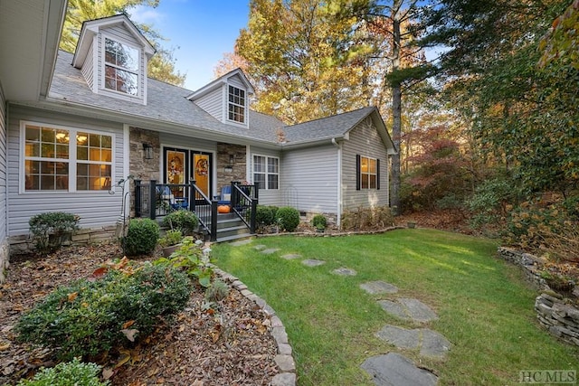 new england style home with a front yard