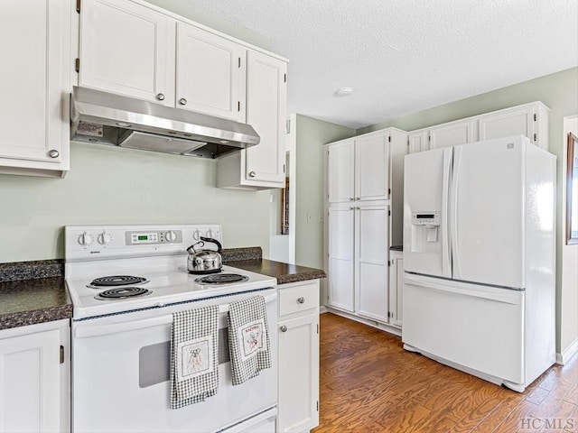 kitchen with hardwood / wood-style flooring, white cabinetry, and white appliances