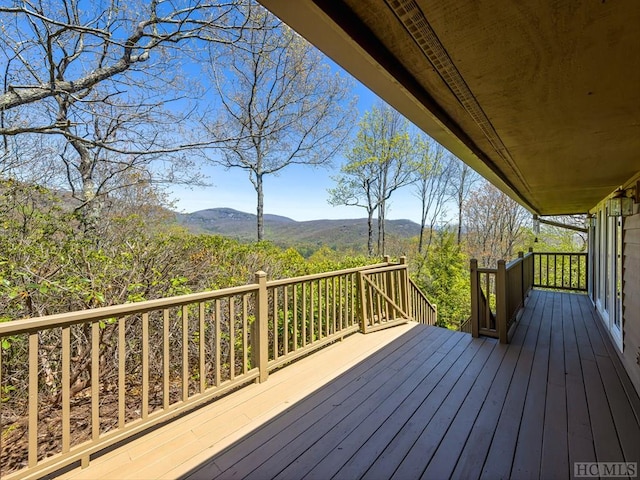 wooden deck with a mountain view