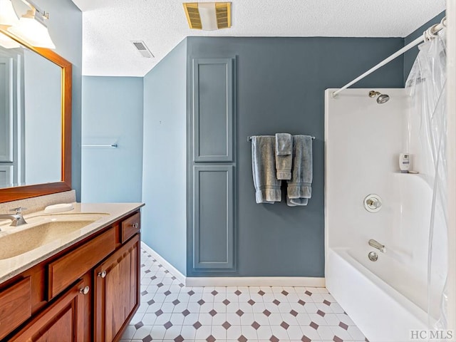 bathroom featuring vanity, a textured ceiling, and shower / bath combo with shower curtain