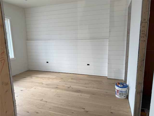 99 Sori Ln, Sapphire, NC 28774 - unfurnished room featuring light wood-style flooring and wooden walls