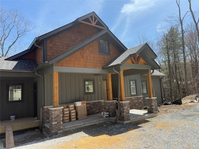 99 Sori Ln, Sapphire, NC 28774 - craftsman-style house featuring roof with shingles, board and batten siding, covered porch, and stone siding